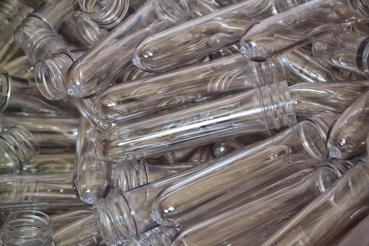 A pile of clear PET preforms